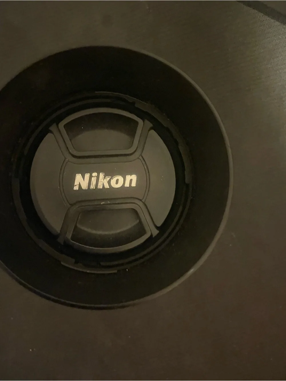 Nikon Black Lens with White Cap and Hood
